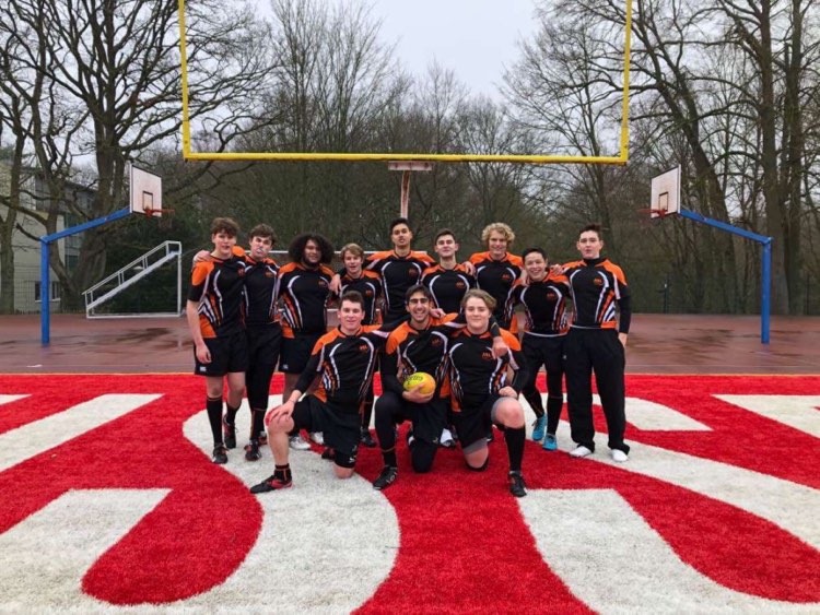 Humphries (top row, fourth from the left) with the varsity rugby team at the International School of Brussels after playing in the 7s tournament. The team lost to Cobham and ISB, tied to ISH, and beat ASP. 