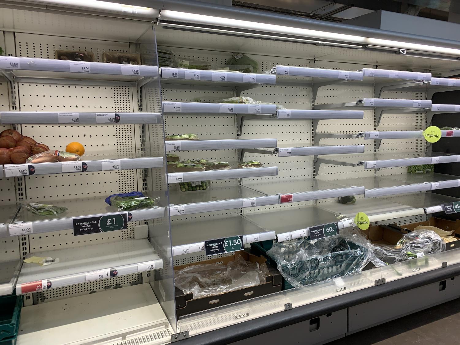 The aisles at the M&S in Earls Court are barren because of panic-buying . Some stores are adding item limits to combat the issue.