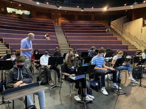 Due to not being able to play instruments, students in band class are learning to use technology to compose music, and at the same time, are following safety precautions such as wearing masks and socially distancing. 