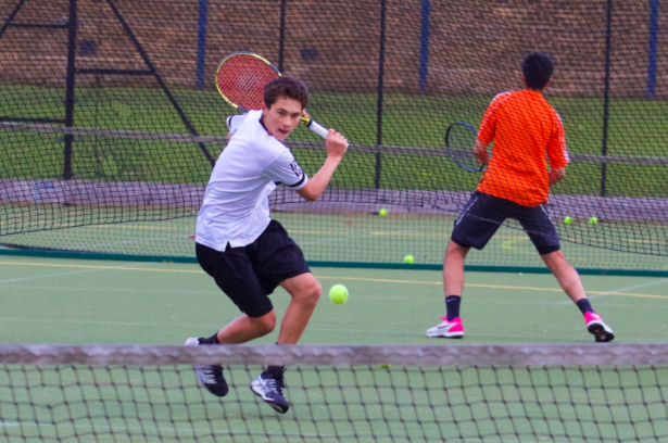 Jake Fellows (’21) gets ready to return a shot in a varsity tennis match against Highgate in May 2019. Fellows committed to Georgetown University for tennis Aug. 17. 