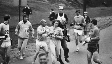 Race officials attempting to stop Kathrine Switzer from running the Boston Marathon. Switzer became the first registered woman to ever officially run the marathon, encouraging a change in athletics legislation calling for more gender equality in marathons. 