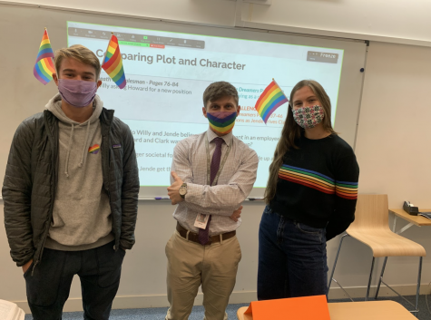 Owen Humphries (’22), English Teacher Sean Linton and Cece Muecke (’21) join the Gender-Sexuality Alliance’s silent protest, wearing rainbow colors to show support for the LGBTQIA+ community. After middle school students hung up a Trump-Pence campaign flag Oct. 19, GSA encouraged students to show up to school Oct. 26 wearing rainbows on masks, flags and stickers.