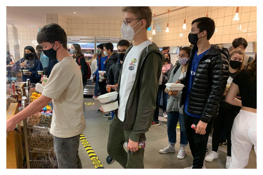 Owen Steege (’22), Aren Turhan (’22) and William Iorio (’22) queue to pay for their lunches in the cafeteria Nov. 9. Grades 10, 11 and 12 ate lunch on campus as the administration modified the open campus policy to permit just one grade level to leave campus each day.