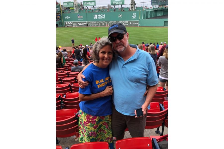 Jennifer Craig and her husband attend a Red Sox baseball game in the U.S. Many members of the community are avid sports fans who attend matches or watch them online. 
