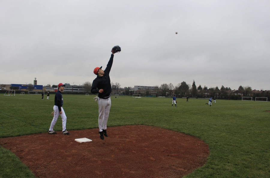 Malakai Spencer (’21) catches a baseball mid-air March 18. Spencer played on the boys varsity baseball team in Grades 9 and 10 as a pitcher and infielder. 