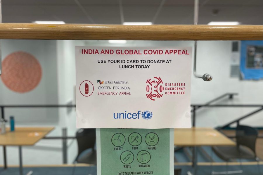A poster encouraging students to donate to organizations supporting those suffering in India hangs in the Theater Foyer. Members of the Community Action Committee organized a fundraiser to help provide vaccines, medical supplies and treatment facilities for Indian relief.