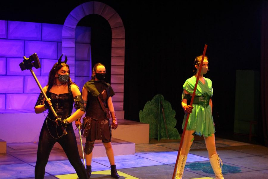 Kleidi Likola (’21), Charlotte Fink (’22) and Danna Rubesh (’22) pose as their characters in the fantasy realm of “Dungeons & Dragons” during a performance June 2. The play had 12 cast members that had been rehearsing for the production since January.