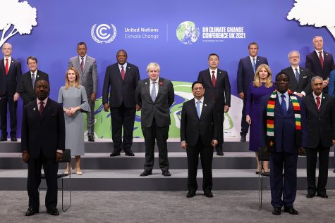 World leaders pose for a photo at the 2021 United Nations Climate Conference. Attendees from each country face public pressure to mitigate the effects of the climate crisis.