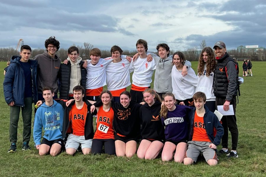 Members+of+the+Running+Club+pose+for+a+group+picture+following+their+races+in+the+London+Schools+Championships+at+Wormwood+Scrubs+Feb.+2.+This+was+the+first+year+the+team+competed+in+the+event.