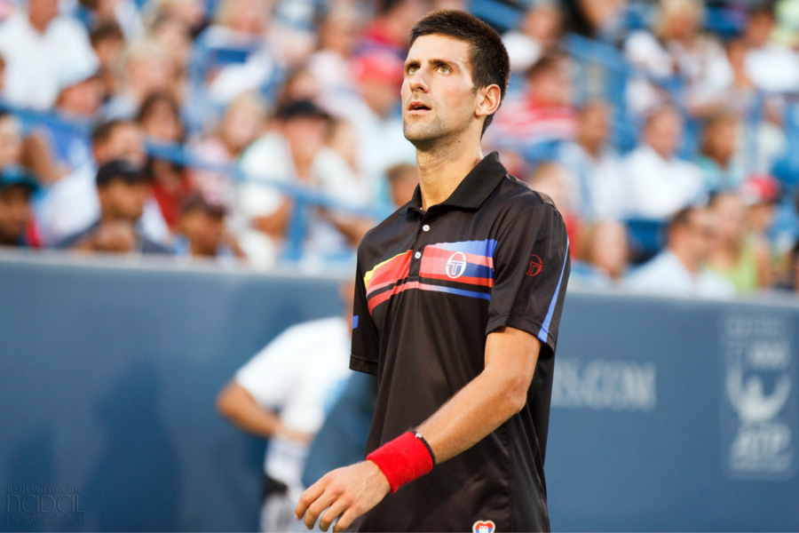 Novak Djokovic plays at the 2011 Western & Southern Open in Ohio. Djokovic has chosen to be unvaccinated against COVID-19, resulting in public backlash after he tried playing in the 2022 Australian Open, per CBS Sports. Now, students and faculty reflect on the effects of Djokovic and other public figures breaking COVID-19 regulations. 