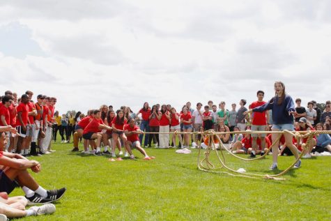 Students gather in a ring around the tug-of-war competition between Grade 11 and Grade 12 June 10, which concluded with the victory of Grade 12.