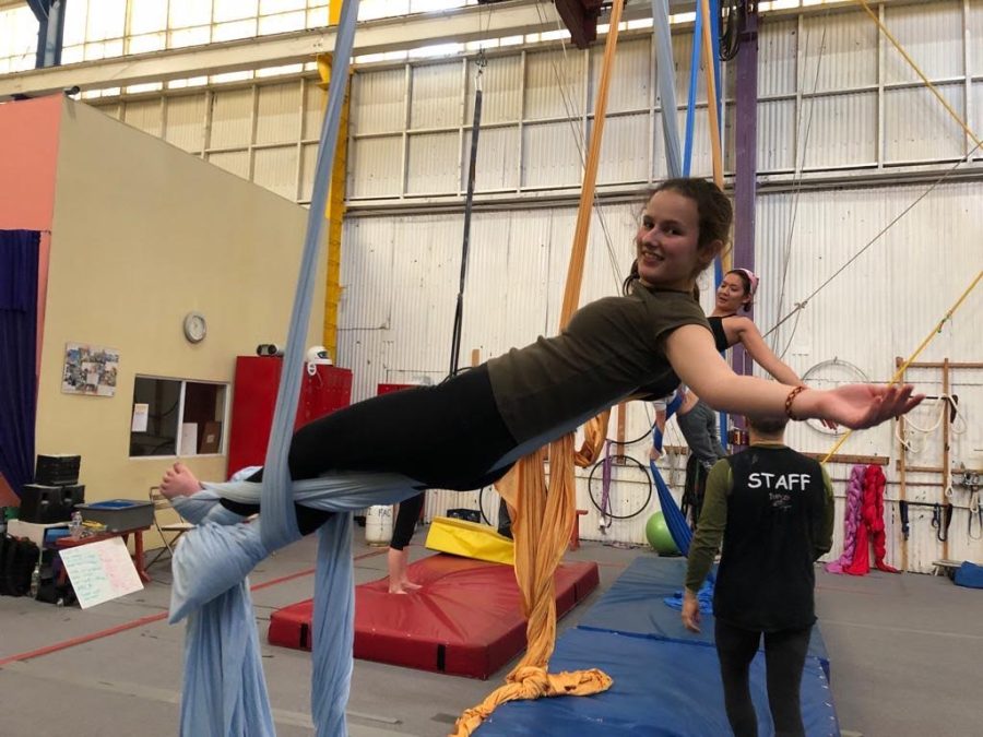 Colette Brown (’23) wraps herself during her aerial silks class. Brown said she has partaken in trapeze and aerial circus since Grade 8 and hopes to continue exploring her passion.