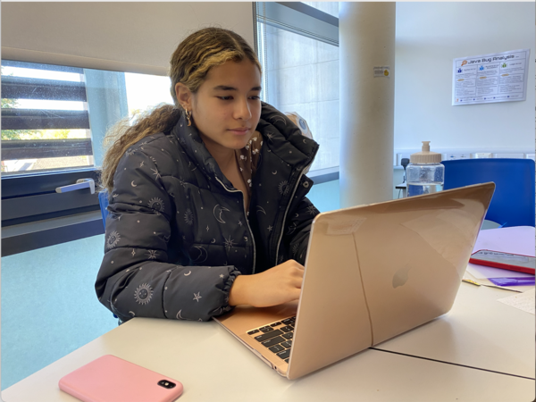 Helena Nakano-Trindade (’26) works on her Science 9 homework. Nakano-Trindade, who transitioned to ASL from another school in London, said she is still adapting to the new environment. However, Nakano-Trindade said she already loves the school. “Everyone’s nicer,” Nakano-Trindade said. “I feel like in class I talk a lot more and you can talk so much more to teachers and ask more questions.”
