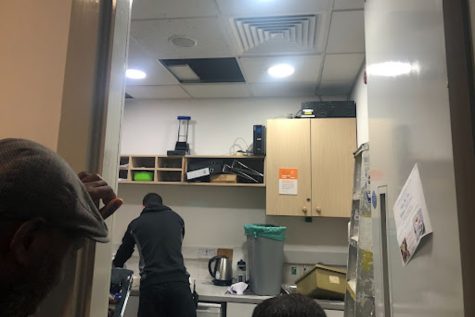 A maintenance team member repairs a fallen ceiling tile in the Top Orange supply closet Jan. 12. Another ceiling tile fell in Bottom O an hour prior.