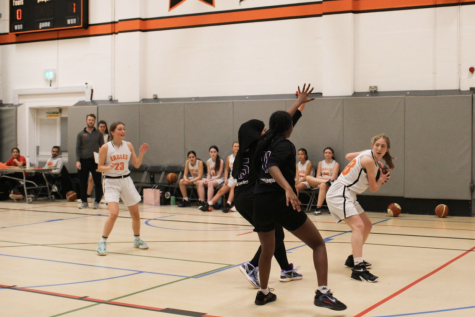 Cleo Destin (’26) dribbles the ball up the court beside her teammates Yara Kassir (’26) and Noor Naseer (’25) Jan. 27. Destin had previously played two years of basketball and enjoys representing the school on her team. I am so happy to be a part of the team, Destin said. Even though we lost, I think we played well defensively and caught many rebounds.