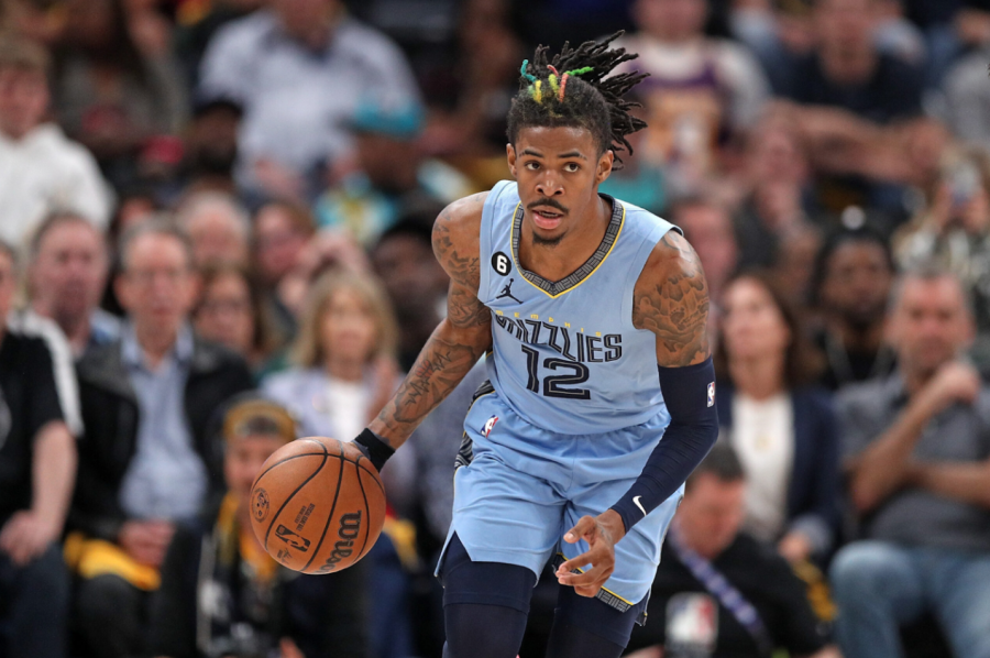 Ja Morant dribbles the ball up the court for the Memphis Grizzlies April 27. He had been suspended indefinitely after being caught with a firearm while travelling with the team, his second suspension after a similar offense in March.