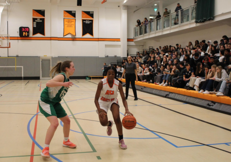 Tamia Windless (’26) dribbles back down the court as she gets ready to shoot. This past season was Windless’ first time on the varsity basketball team.