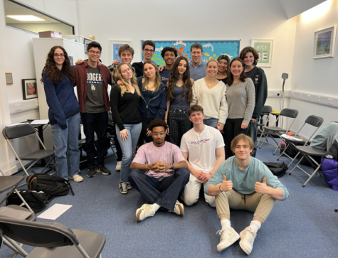 Direct of Student Life James Perry poses with his those part of his Peer Leadership class. Throughout the year, the group meets periodically, with his students mentoring Grade 9 advisories.
