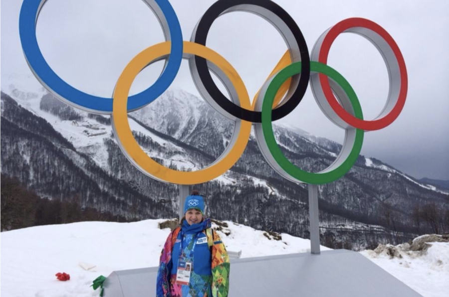Tamara Smith poses in front of the Olympics symbol. Smith pursues multilingualism in various forms.