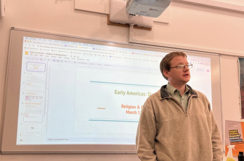 Travis Schill explains an assignment while teaching his World Civilizations class. He previously taught in Saudia Arabia, Mongolia, China and Venezuela.