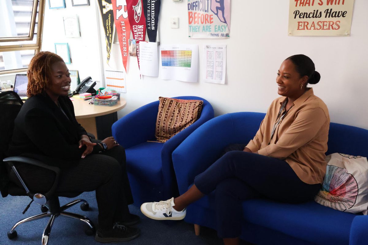 HS counselors Johnice Moore and Yanna Jackson chat in Moores office. Both counselors joined the school this year but have previous experience in similar positions. 