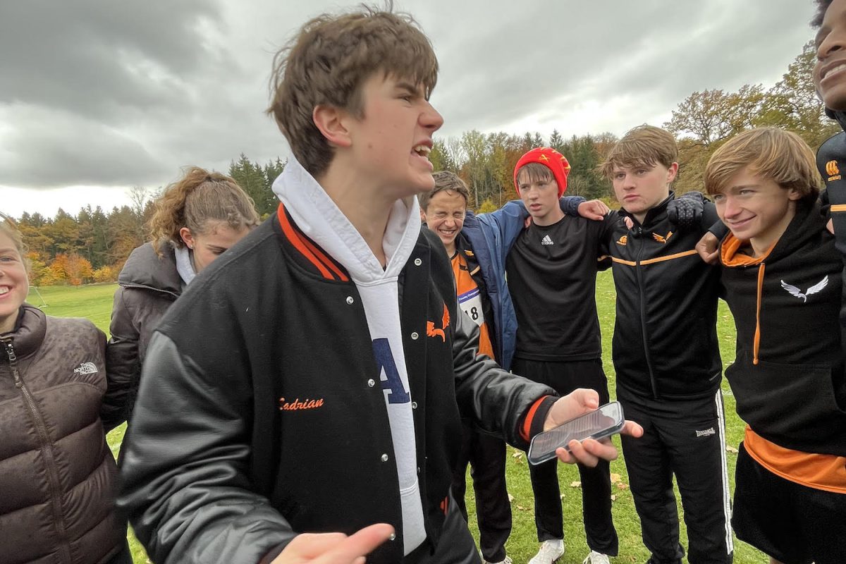Cross country co-captain Noah Sadrian (’25) gives a speech to the team before the 5km race at ISSTs. Sadrian provided words of inspiration for teammates in preparation for the race, chanting “clear eyes” and their final yell of “Go Eagles!” before they lined up to race. 