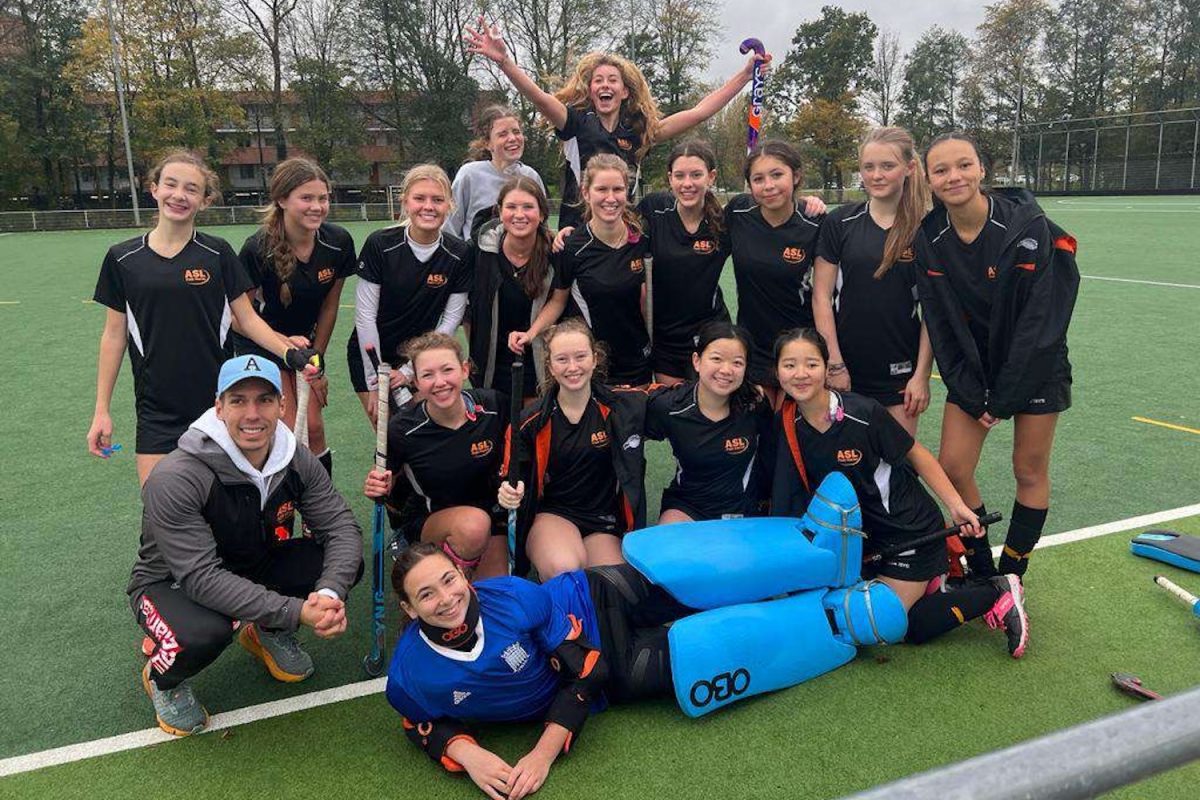 The field hockey team celebrates after their ISST victory in The Hague Nov. 11. The British School of the Netherlands hosted the tournament where the team played four matches before taking home the trophy.