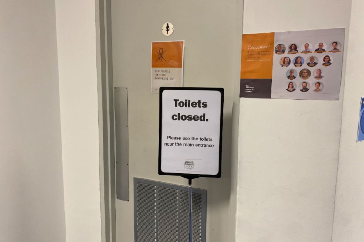 A sign states that high school toilets are closed and redirects students to other working bathrooms. The toilets were temporarily closed March 1-4 because of a pipe leak.