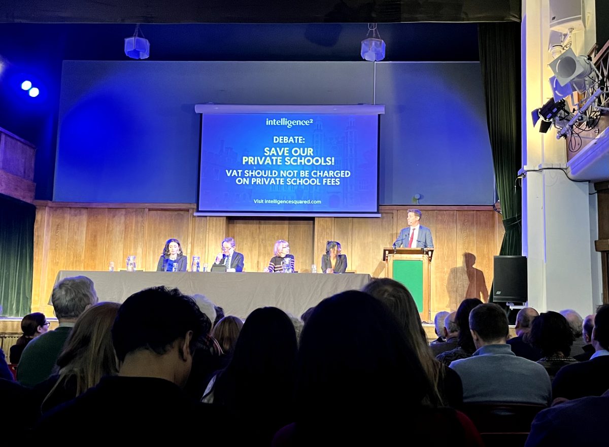 British Journalist Fraser Nelson stands at the podium to present their opposing perspective on the proposed Value Added Tax on private schools by the Labour Party. The VAT would likely be charged at 20% and be added to annual tuition. 