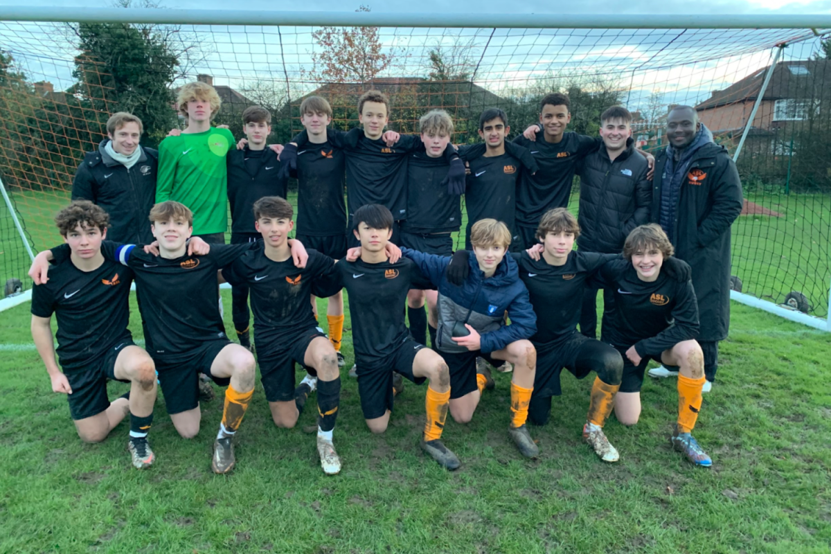 The boys U15 ISFA team pose for a team picture after a 3-2 win in the game preceding the ISFA Shield tournament quarter finals Nov. 29, 2023. They scored in the last minute of the game to win the match against Claremont.