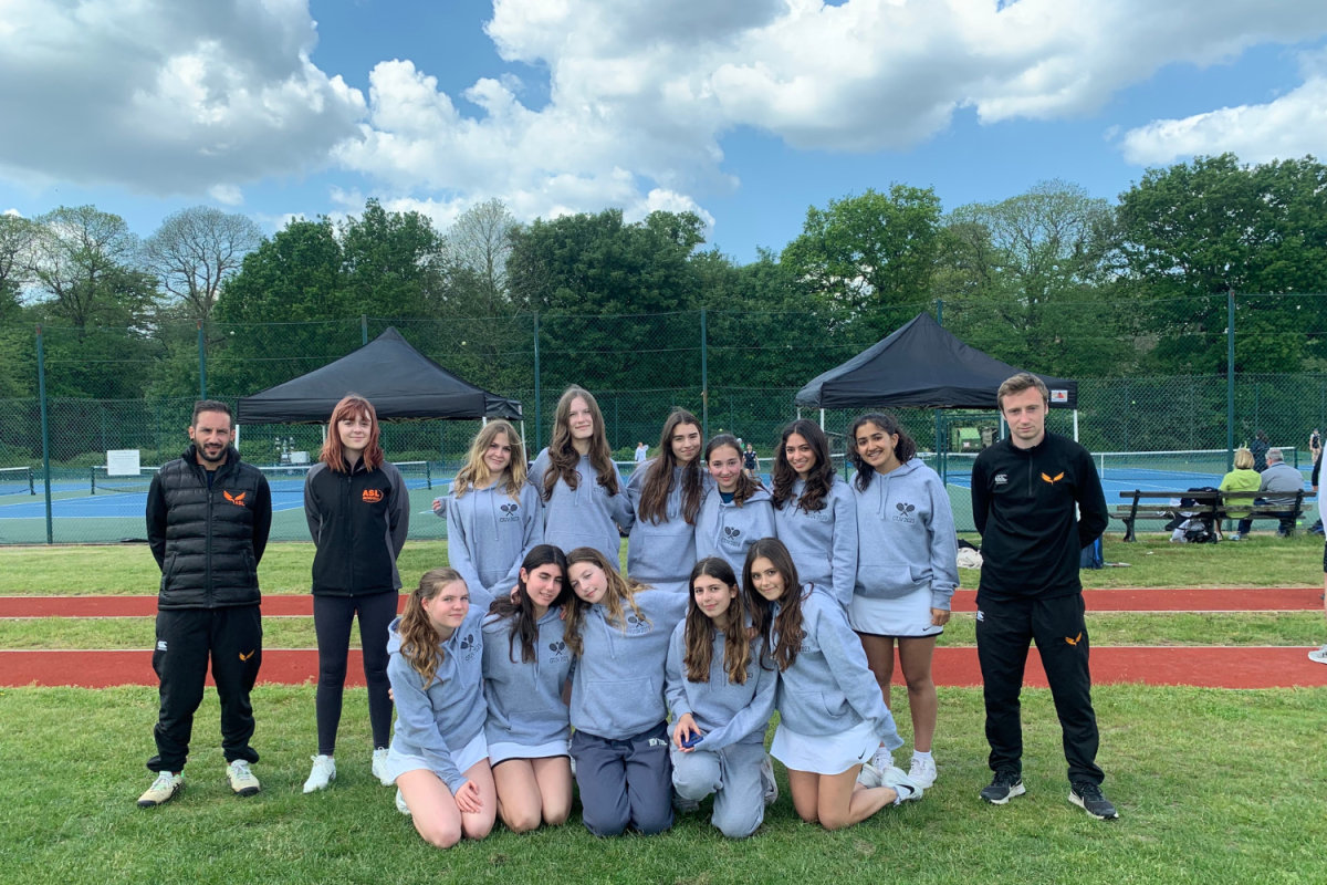 The JV girls tennis team poses for a group photo after a tournament at ACS Cobham during the 2023 season May 20. The team played against various London schools but did not play against any of the ISST member schools. 