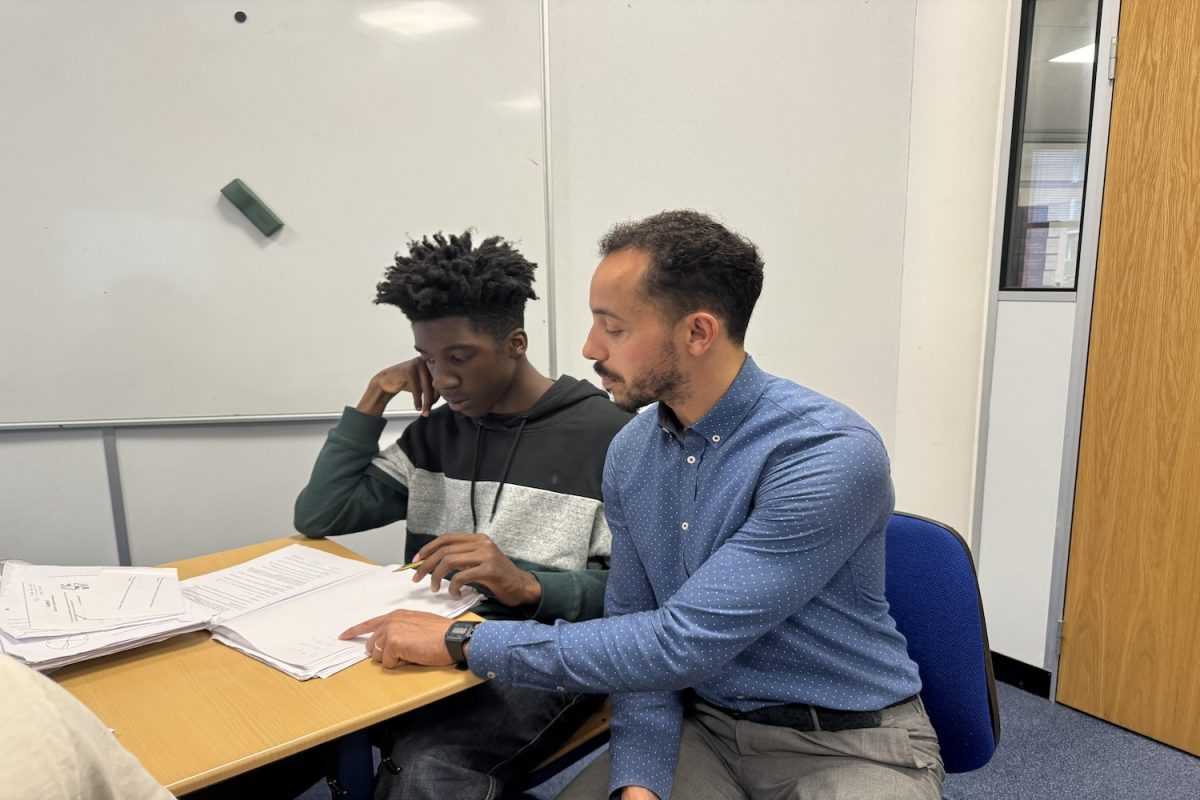 Dylan Chambers teaches Jelani Conteh (’26) in Algebra II May 28.  He shared his experiences from the 12 years he has spent teaching at the school. 